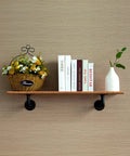 Ten Pack 7 Inch Industrial Pipe Shelf Brackets Heavy Duty Unibody For 8 To 14 Inch Boards supporting a shelf with decor