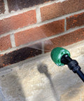 Applying The Real Deal Deep Penetrating Siloxane Masonry Sealer For Brick Concrete And Stucco using a spray nozzle on bricks.