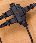 6 Foot Indoor Extension Cord With 3 Outlets, 16 Gauge Power Strip, 2 Prong Plugs, black cord on wooden surface