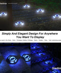 Blue Solar Deck Lights 12 Pack Outdoor LED Path Markers illuminating a garden pathway at night