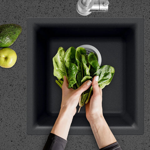 E-100 Midnite Quartztone Bar Sink Dual Mount 13x13 Inch Single Bowl Black with spinach being washed, top view