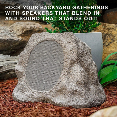 Rock Speaker Connect Stone Outdoor Wireless Speaker With Bluetooth 5.3 blending into garden setting, featuring stone texture and speaker grill