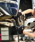 Mechanic using 12V Cordless Extended One Quarter Inch Ratchet Wrench Kit With LED Light, 30 Ft Lbs Torque on car wheel