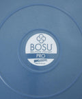 Close-up of the Bosu Pro label on the Half Ball Balance Trainer 26 Inch Pro Stability Dome For Home Gym Cardio And Strength Training A Dope Commercial-Grade Fitness Gear With Guided Workouts And Hand Pump For Core Stability And Full Body Training.
