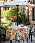 60 Inch Round Outdoor Tablecloth With Umbrella Hole And Zipper Spillproof And Wrinkle Free Paisley Patio Cover For Spring And Summer Backyard Parties BBQ Decor And Outdoor Dining on a patio table with umbrella and chairs