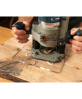 Straight Up Butterfly Router Inlay Template Machined From Thick Clear Acrylic Guaranteeing No Sweat Plunge Router Cuts For Your Next Killer Woodworking Project Everyone Loves in use with a router on wood.