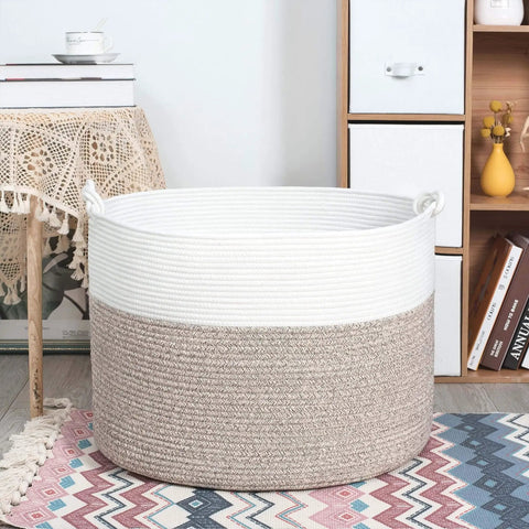 Extra Large 22x16 Inch Cotton Rope Storage Basket With Grab Handles A Rugged Yet Chic Woven Bin For Blankets Pillows Towels Laundry Toys Shoes And More Perfect For Easy Home Organization In Black Or Gray placed in a living room scene