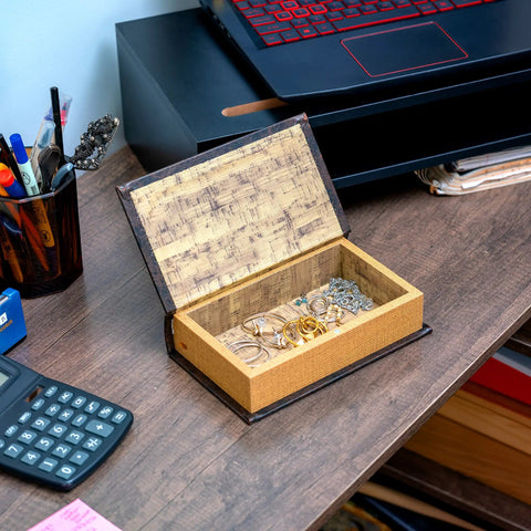 Faux Book Safe With Hidden Compartment For Small Valuables And Cash on desk with jewelry inside.