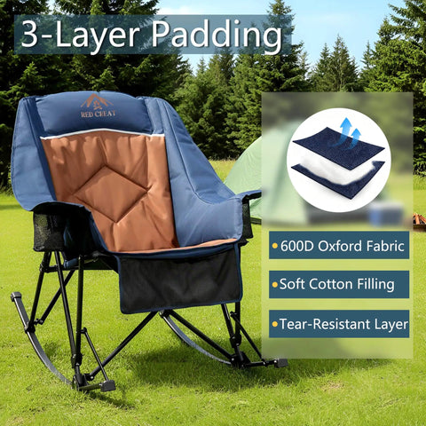 Big And Tall Rocking Camping Chair With 400 Lb Capacity in navy, featuring padded high back and cup holders, on grassy lawn.