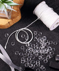 Upgraded Window Setup With This Dope Set Including 100 Clear Roman Rings And 55 Yards Of Heavy Duty White Cord For Stress Free Reweaving And Clean Modern Vibe For Quick Diy Projects Around The House featuring clear plastic rings and white cord.