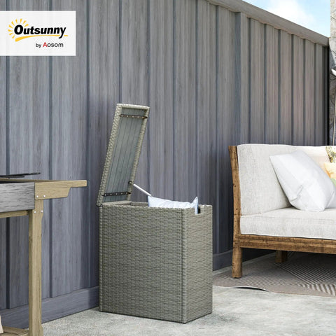 Weatherproof 17.3 Gallon Wicker Storage Box With Slatted Acacia Wood Flip Top next to outdoor sofa on patio