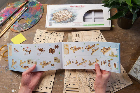 Antique Box 3D Wooden Puzzle Kit For Adults Craft Your Own DIY Mechanical Model Brain Teaser Hobby Set For Home Decor Jewelry Box Project Hands On Fun Today, box parts and instructions on table
