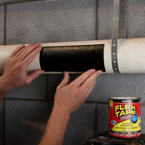 Heavy Duty Rubberized Waterproof Tape being applied to pipe, black 4 in by 5 ft, ideal for patching leaks and sealing repairs underwater