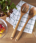 13.5 Inch Teak Cooking Spoon Wooden Mixing Spoon Handcrafted From Teak With High Moisture Resistance on plaid napkin