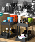 Heavy Duty Black Under Sink Organizer 2 Pack with Smooth Glide Sliding Drawers for Bathroom Cabinet, showcasing organized items.
