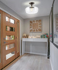 Dope Oil Rubbed Bronze Modern Farmhouse LED Flush Mount Light With Clear Glass Shade in a modern hallway setting