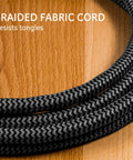 Two Pack 3 Outlet Mini Power Strips With Braided 5 Inch Cords For Desk And Entertainment Setups Ideal For Home And Office Use Compact Space Saving Power Extensions That Help Keep Cables Tidy And Ready. Braided fabric cord close-up on wooden desk, resists tangles