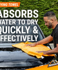 Man using drying towel on car hood from All In One Car Wash Kit With Ultra Shine Soap Plush Wash Mitt Microfiber Towel And Wax Buff For A Showroom Shine Without The Hassle.