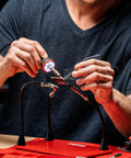 Person using 30W Soldering Iron With LED Halo Ring For Killer Precision, 360 Degree Bright Light, Ergonomic Pencil Grip on circuit board