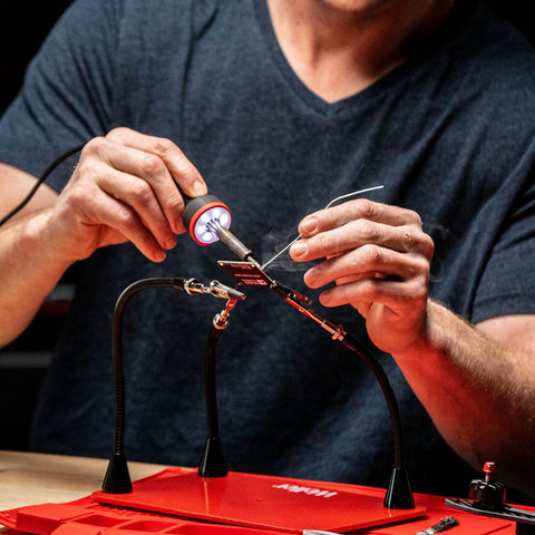 Person using 30W Soldering Iron With LED Halo Ring For Killer Precision, 360 Degree Bright Light, Ergonomic Pencil Grip on circuit board