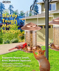 Chew Proof Metal Bird Feeder For Outdoors With Copper Finish Holds About One Point Three Two Pound Seed Three Perches Squirrel Proof Roof And Tray Weather Resistant Hanging Cardinal Feeder Seed Not Included shown hanging on a pole with a cardinal feeding.