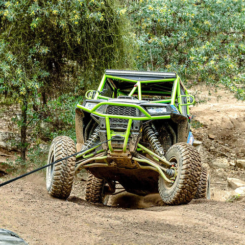 ATV using 4500 Pound Waterproof Electric Winch For ATV And UTV With Synthetic Rope on rugged off-road terrain