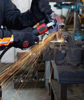 Straight From The Shop Floor Heavy Duty 4.5 Inch Air Angle Grinder in action with sparks flying during metal work.