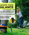 Person using BananaLama XL Slackline With TreeWear Do It All Slack Line Kit on a grass field, showcasing balance and setup.