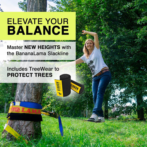 Person using BananaLama XL Slackline With TreeWear Do It All Slack Line Kit on a grass field, showcasing balance and setup.
