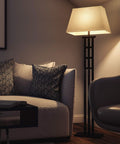 McIntosh Floor Lamp in Bronze Finish With Geometric Mission Design, 58 Inch Tall, next to a sofa in a cozy living room setting