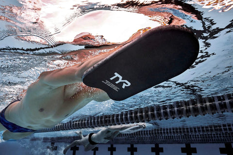 Swimmer using Classic Swim Kickboard For Training And Pool Workouts, All Ages, Durable Foam Kickboard to build kicking power in pool