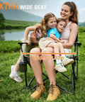 Family seated on Big And Tall 400 Pound Heavy Duty Folding Camp Chair With Solid Metal Armrests And Swivel Cup Holder, wide 22 inch seat