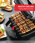 T-Fal OptiGrill Indoor Panini Press With Smart Sensor Tech grilling skewers and vegetables on nonstick plates, ideal for healthy cooking.