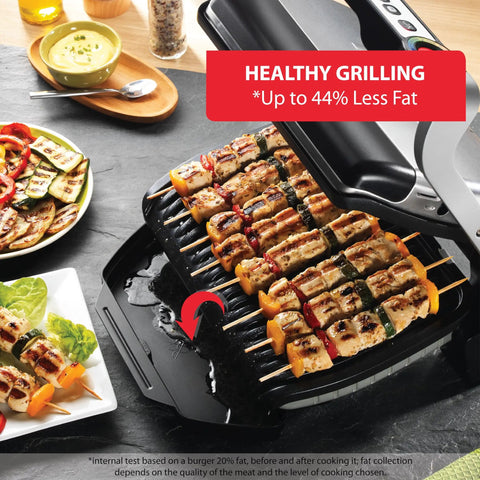 T-Fal OptiGrill Indoor Panini Press With Smart Sensor Tech grilling skewers and vegetables on nonstick plates, ideal for healthy cooking.
