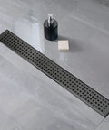 24 Inch Linear Shower Drain With Removable Square Pattern Grate Matte Black Stainless Steel Includes Hair Strainer visible in shower