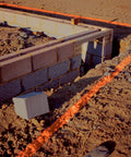 Construction site foundation marked with Industrial Choice M1400 Water Based Construction Marking Spray Paint 17 oz Gloss White.