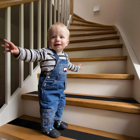 Child standing on stairs with Heavy Duty Anti Slip Grip Tape With 80 Grit For Indoor Outdoor Stairs Non Slip Traction Treads