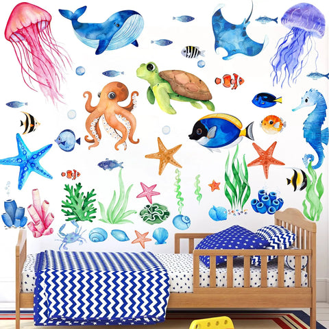 Glow In The Dark Ocean Wall Decals Set With Sea Life Stickers Waterproof Peel And Stick For Boys Kids Bathroom Decor Under The Sea Watercolor Ocean Creatures Upgrade shown on wall above children's bed with colorful sea creatures