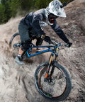 Mountain biker riding downhill with Combat II Mountain Bike Grips With Lock On Clamp Double Lock Security for solid hold.