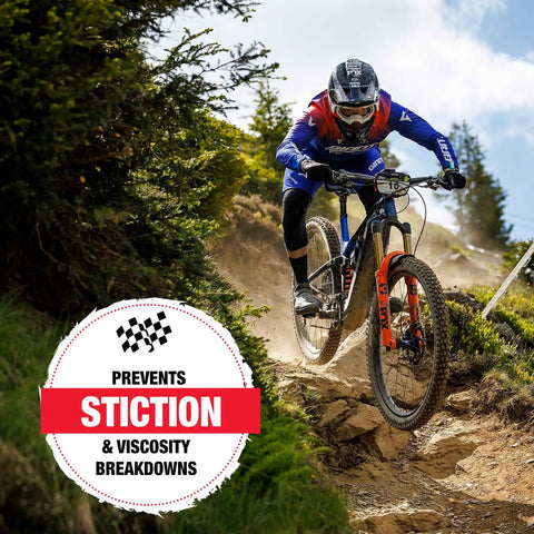 Mountain biker on trail using 10Wt Suspension Shock Oil For All Bicycle Forks And Seals, Premium Semi-Synthetic Non-Foaming Fluid