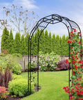 Tall Black Garden Arch Trellis 8.2 Ft High 6.2 Ft Wide Outdoor Arbor For Climbing Plants Roses And Vines Built To Last Perfect Lawn Wedding Archway Durable Weatherproof Construction in a garden with climbing roses