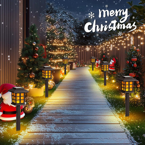 Outdoor Solar Torch Lights 10 Pack With Dope Flickering Flame illuminating a snowy garden path with Christmas decor