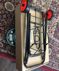 Foldable Lightweight Two Wheel Shopping Cart Dolly with easy open design on a box with red wheels, perfect for luggage transport.