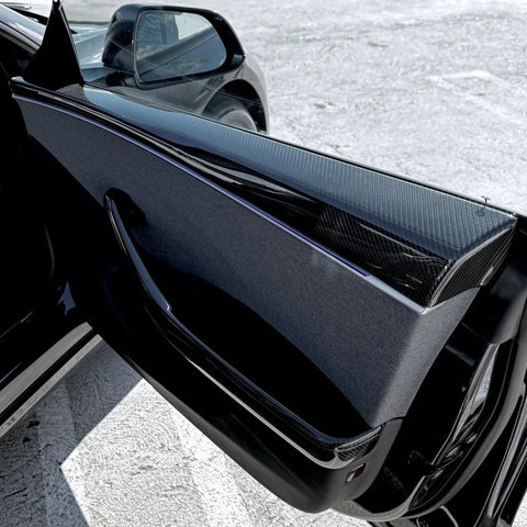 Autoclave Pressed Real Dry Carbon Fiber Door Panel Overlays Fits Tesla Model 3 Highland And Model Y Slick Matte, close-up of installed panel.