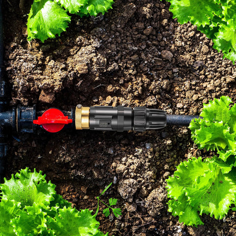 Drip Irrigation Faucet Adapter Kit with 25 PSI Water Pressure Regulator Backflow Preventer and Filter in a garden setup