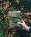 Rhino Rescue survival first aid kit MOLLE pouch, green tactical medical kit, front view.