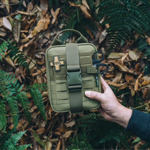 Rhino Rescue survival first aid kit MOLLE pouch, green tactical medical kit, front view.
