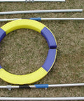 Disassembled Pro Grade Durable Dog Agility Tire Jump With Non Rust Aluminum Frame on grass, showcasing components.