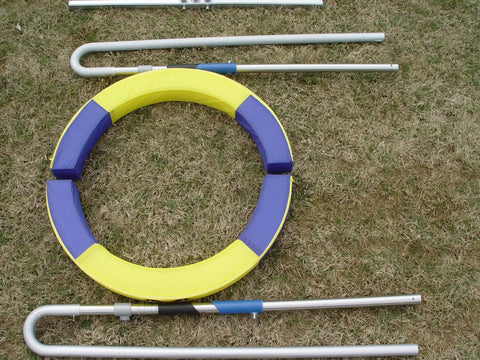 Disassembled Pro Grade Durable Dog Agility Tire Jump With Non Rust Aluminum Frame on grass, showcasing components.