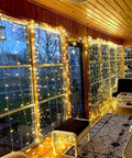 Two Pack Fairy Curtain Lights For Bedroom 600LED USB Plug In With Remote Eight Modes Wall Hanging Twinkle String Lights Warm White About Ten By Ten Feet Christmas Backdrop Decor Party Wedding Diy Copper Wire installed indoors on windows